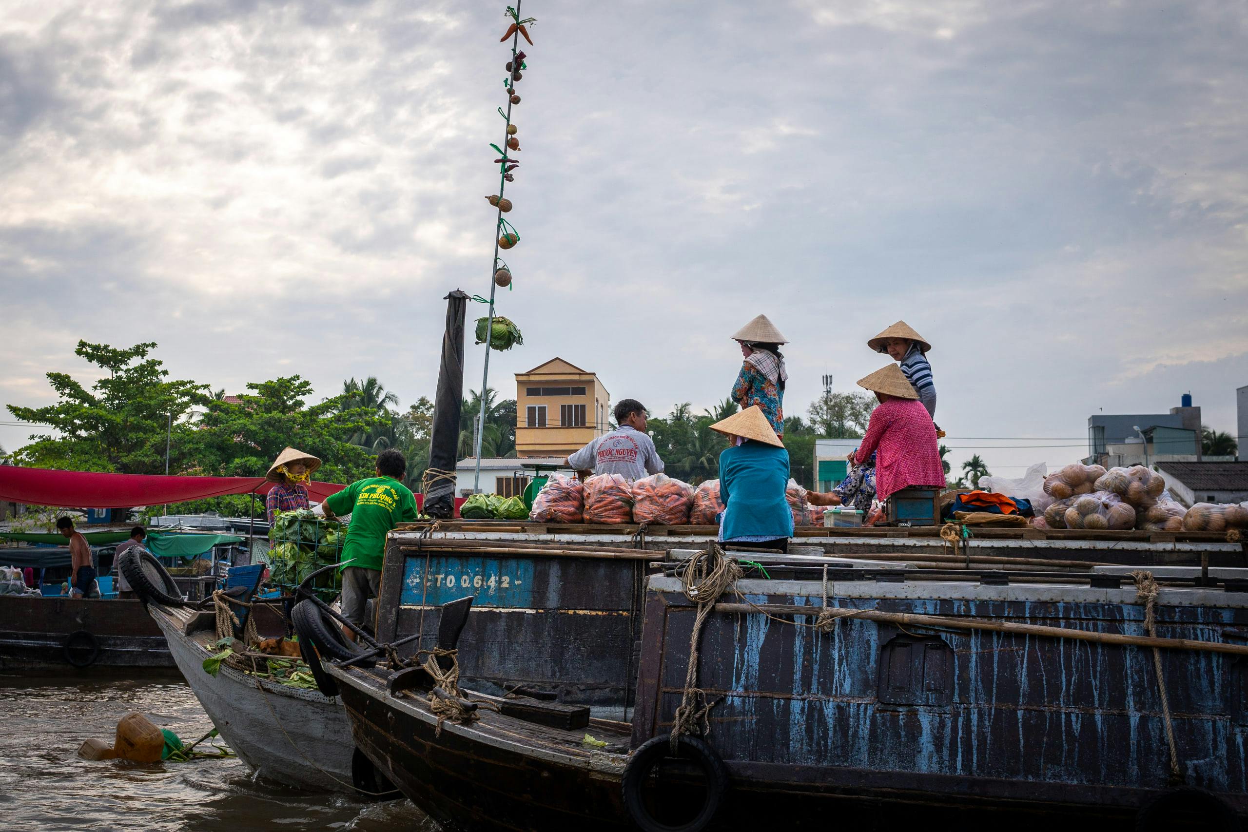 Merchants on a boat in a floating market
