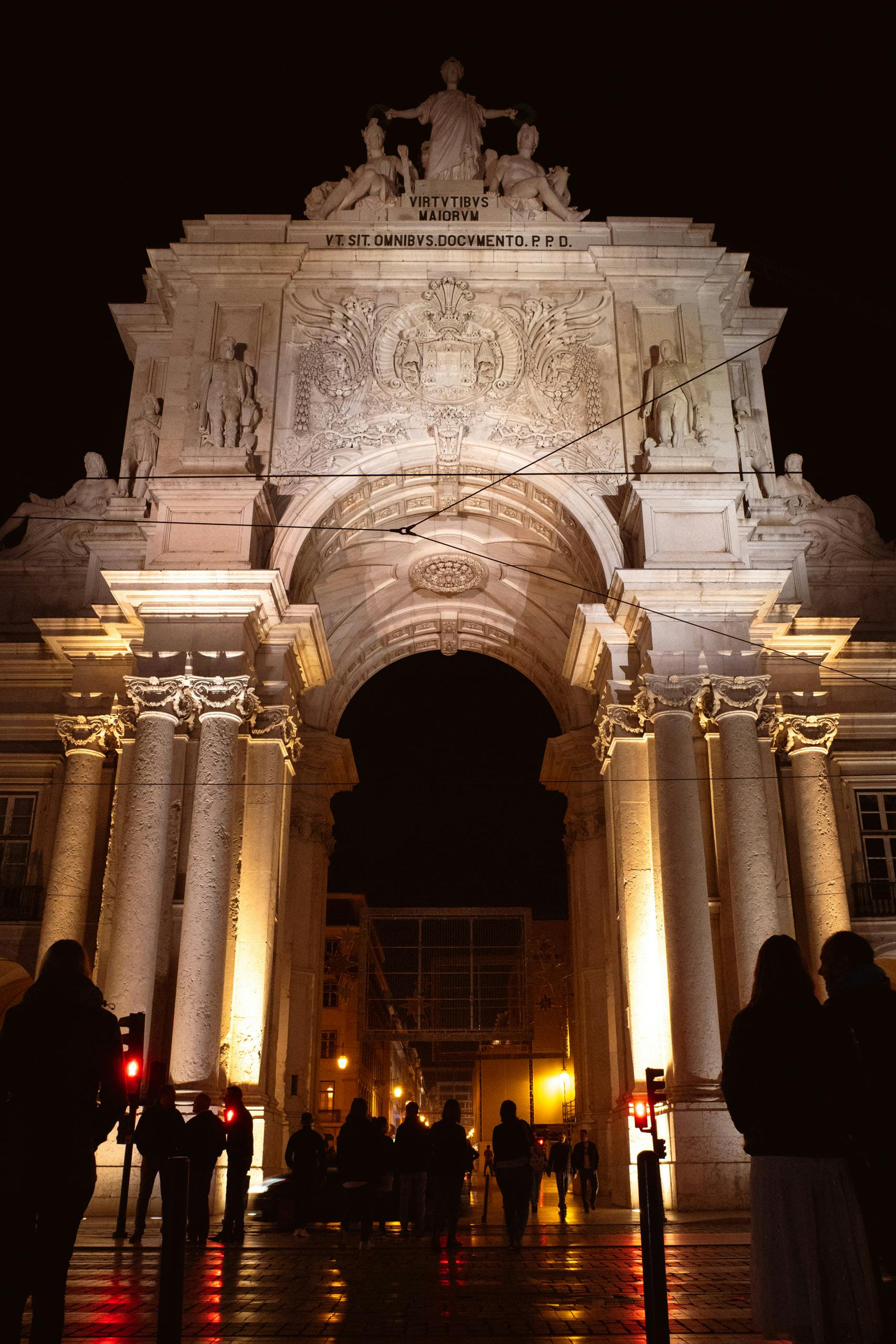 Front of an arch at night