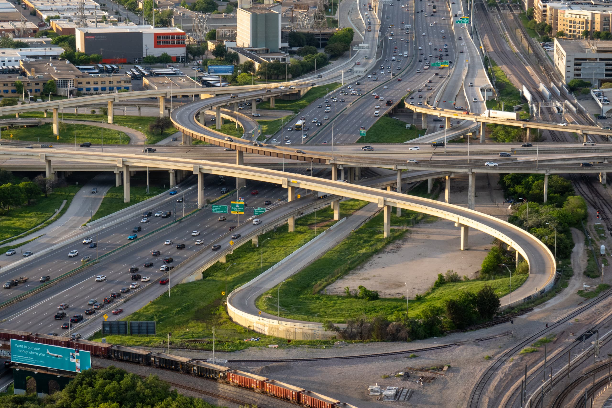 Freeway with many curved overpasses and cars