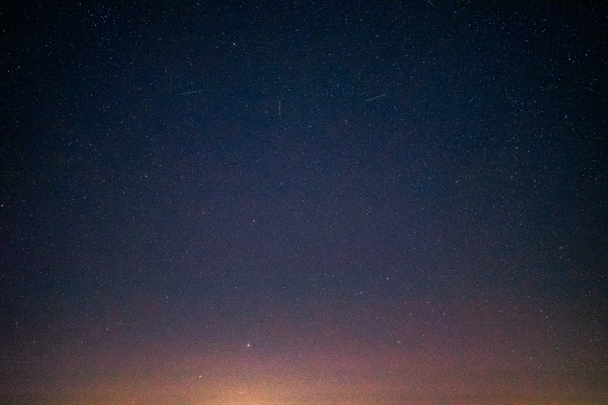 Starry night sky with some streaks of shooting stars